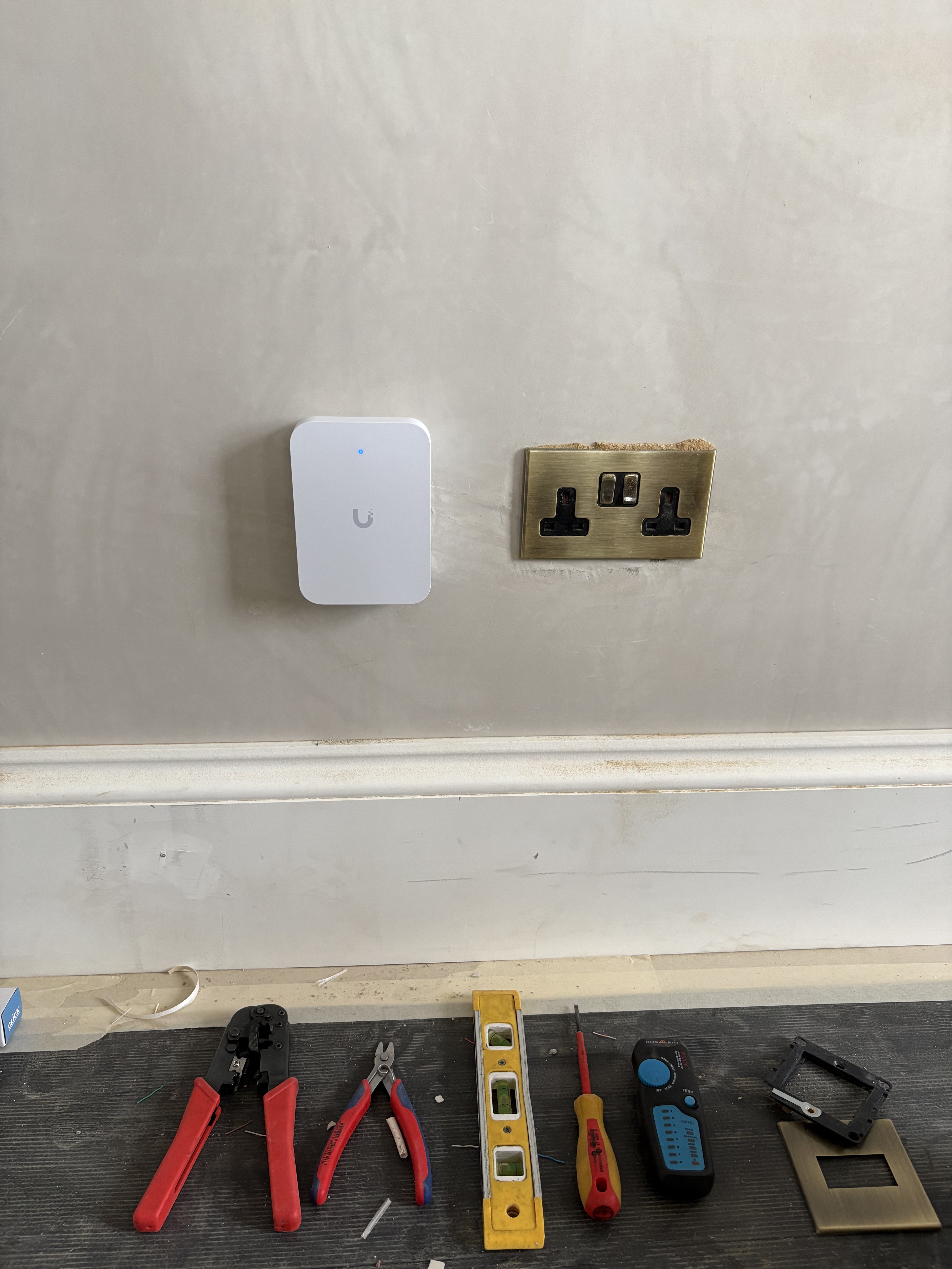 UniFi U7 In-Wall access point installed neatly in Sean's new build home