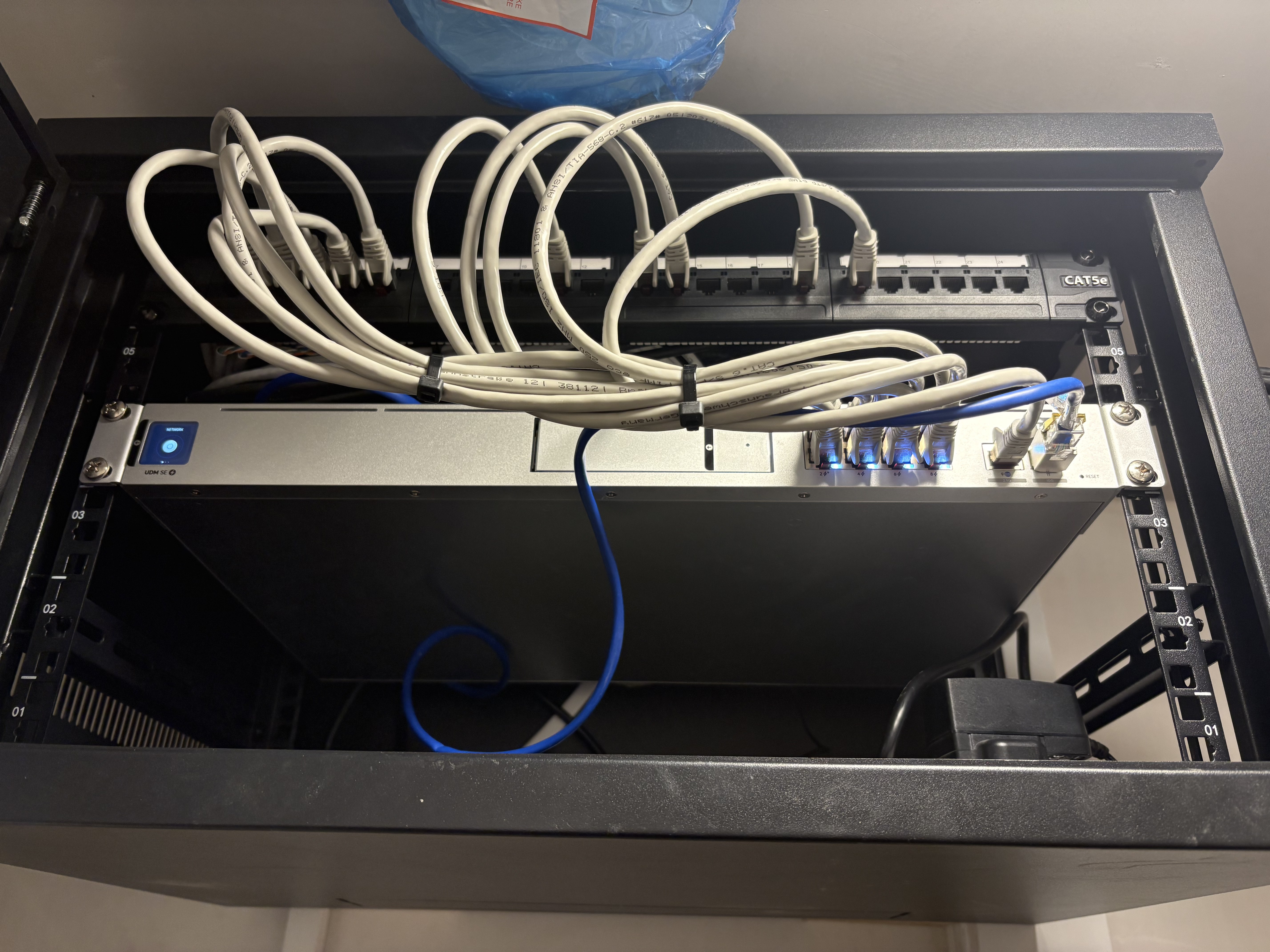 Comms cabinet with Dream Machine SE and networking gear for Sean's new build