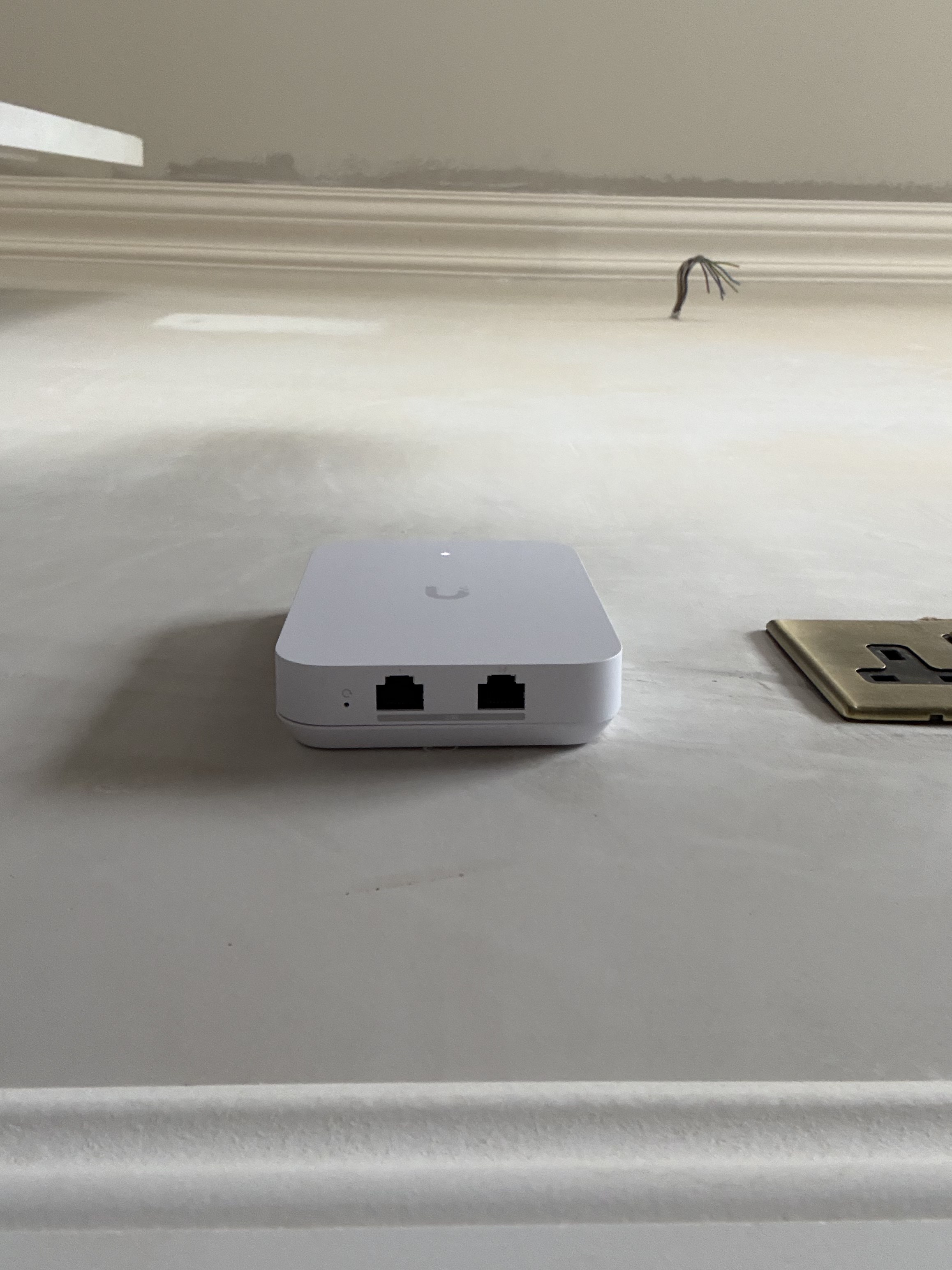 Front ethernet ports on a UniFi U7 In-Wall access point in Sean's new build home